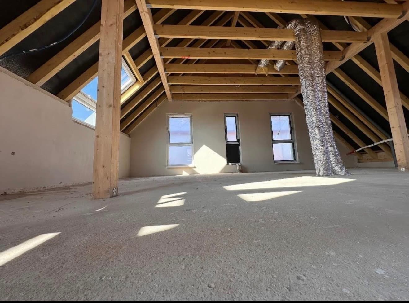 Combles aménagés avec charpente apparente